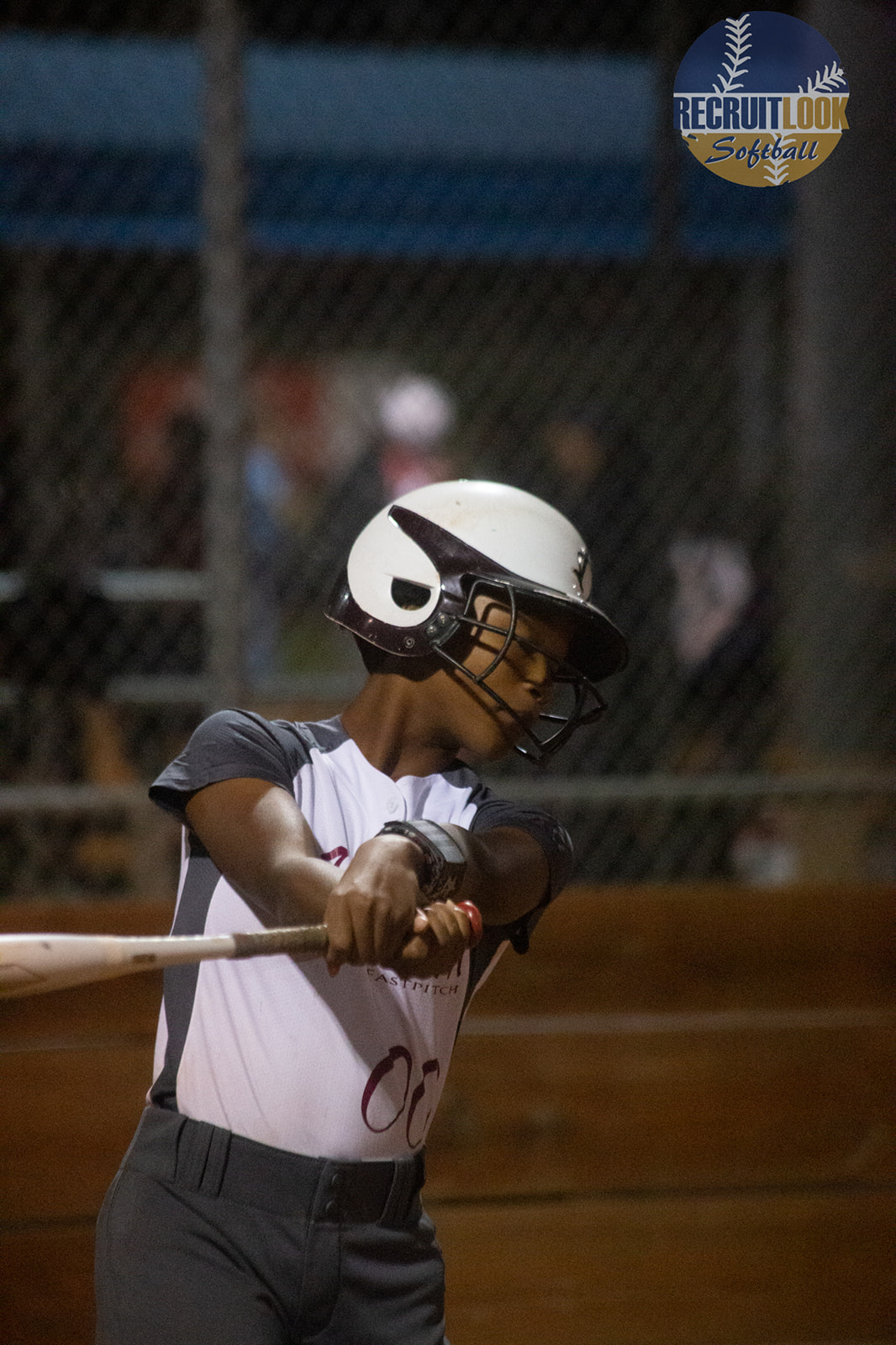 Softball player batting