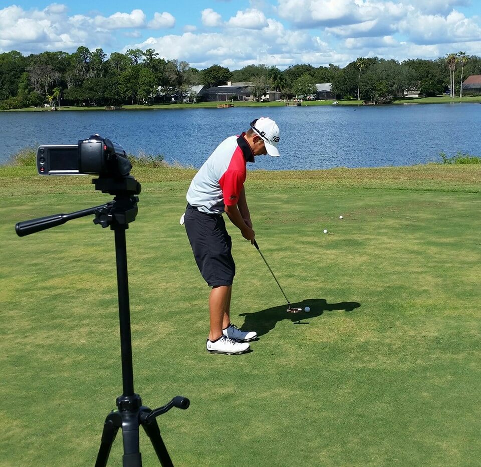 Golf athlete being filmed for evaluation