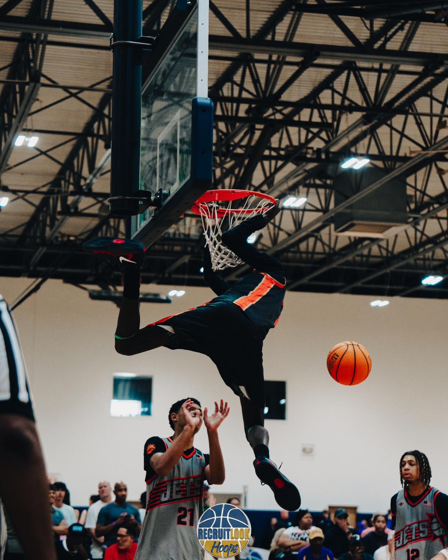 Basketball player performing an impressive dunk